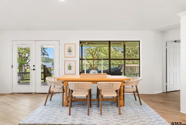 a dining room with furniture and wooden floor