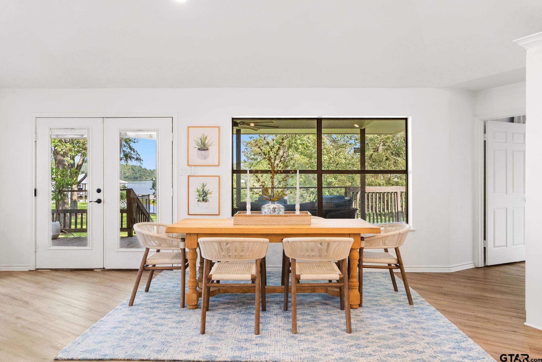 13235 Peninsula Road Whitehouse, TX 75791 - Photo 15 of 48 a dining room with furniture and wooden floor