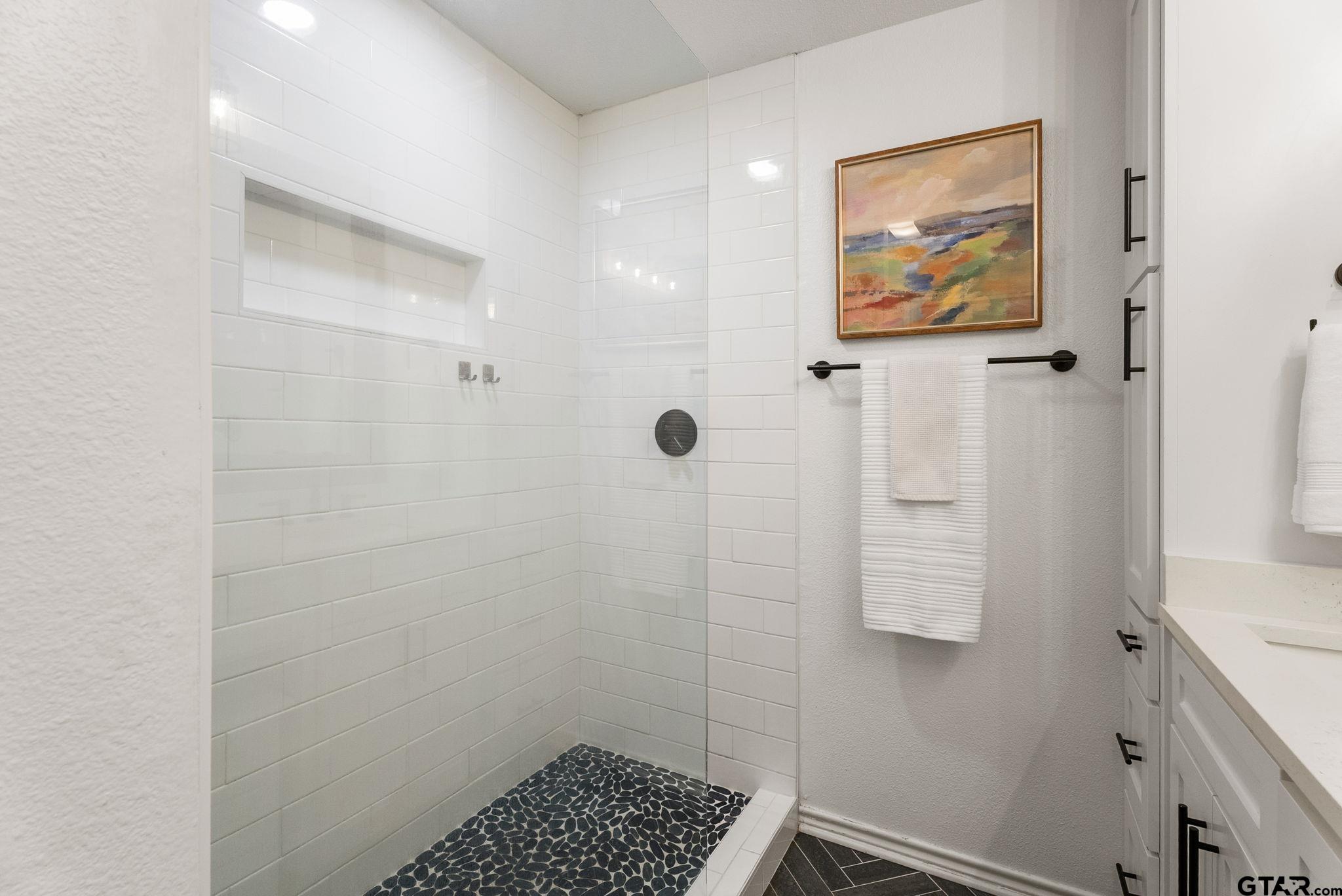 13235 Peninsula Road Whitehouse, TX 75791 - Photo 20 of 48 a bathroom with a shower and a sink