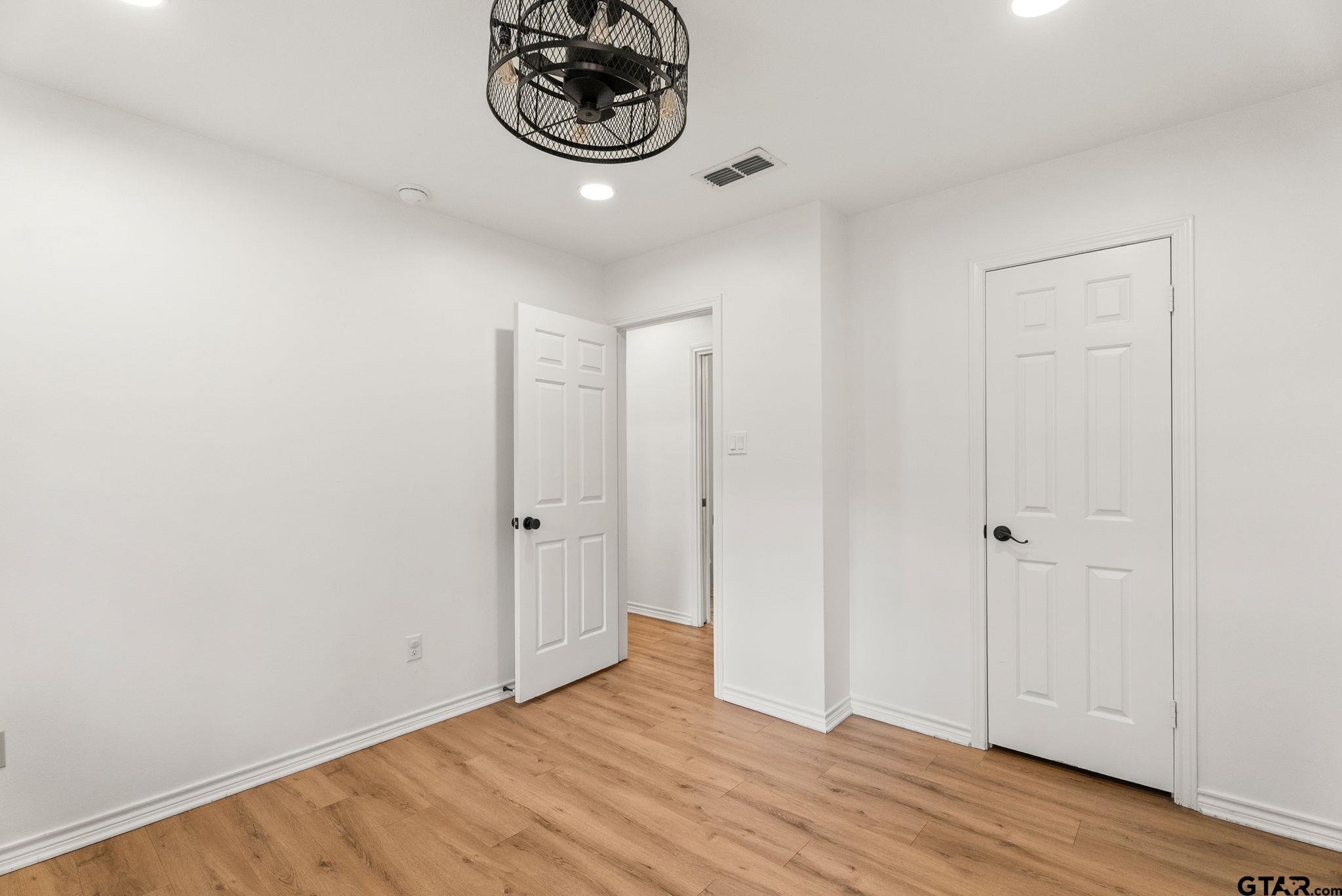 13235 Peninsula Road Whitehouse, TX 75791 - Photo 24 of 48 a view of an empty room and wooden floor