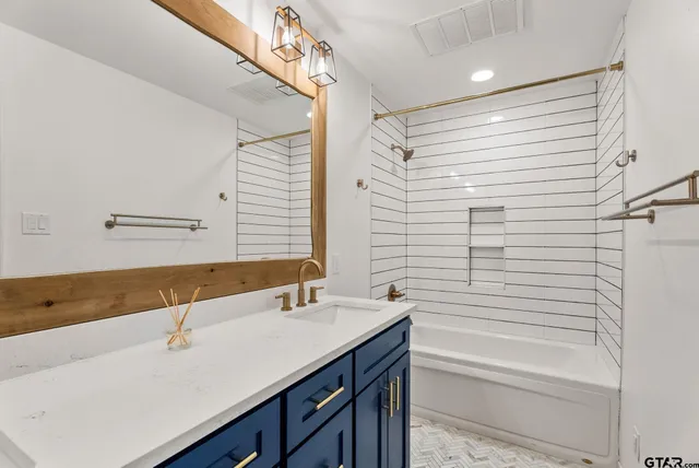 a bathroom with a sink and a bathtub