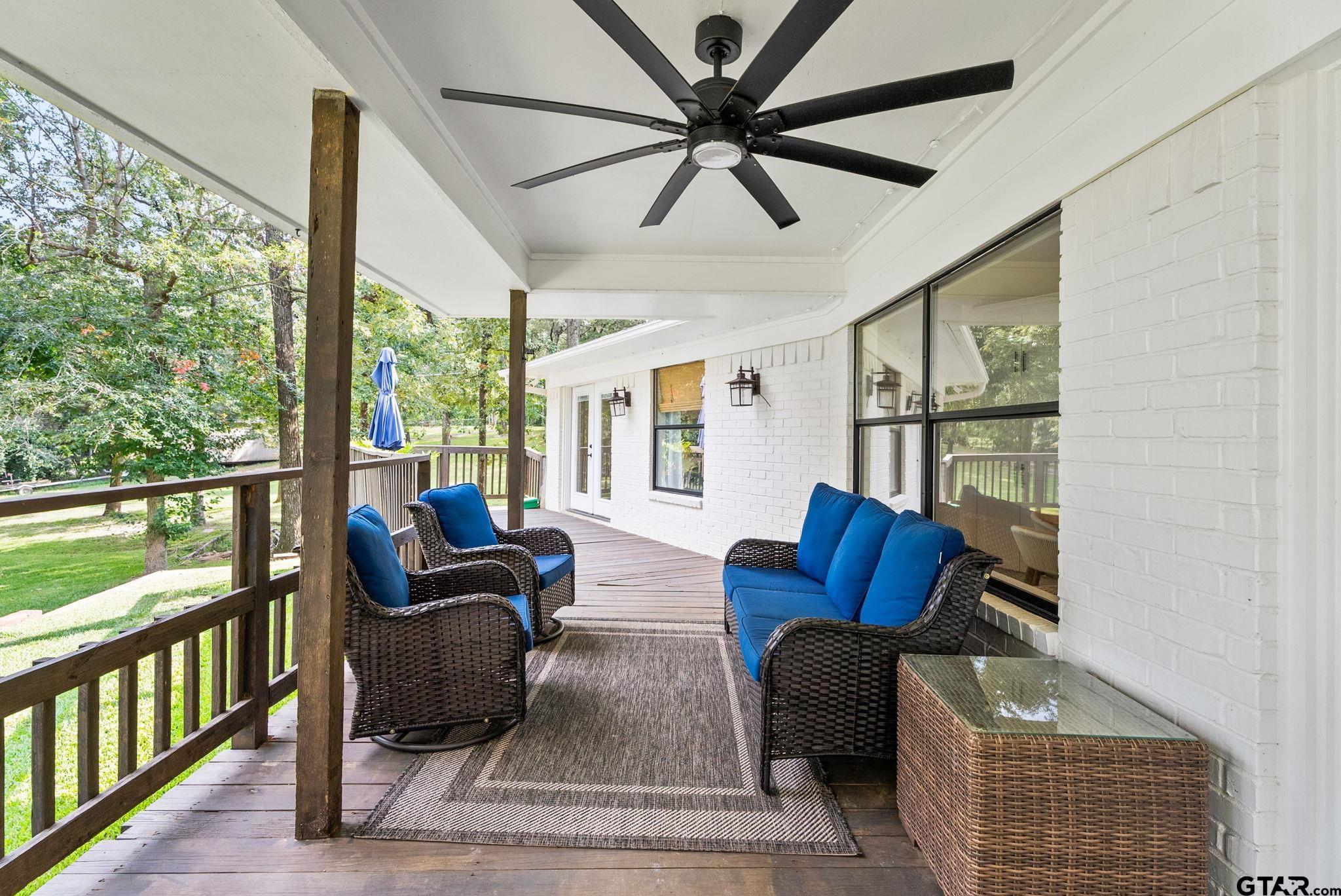13235 Peninsula Road Whitehouse, TX 75791 - Photo 27 of 48 a living room with furniture fireplace and a large window