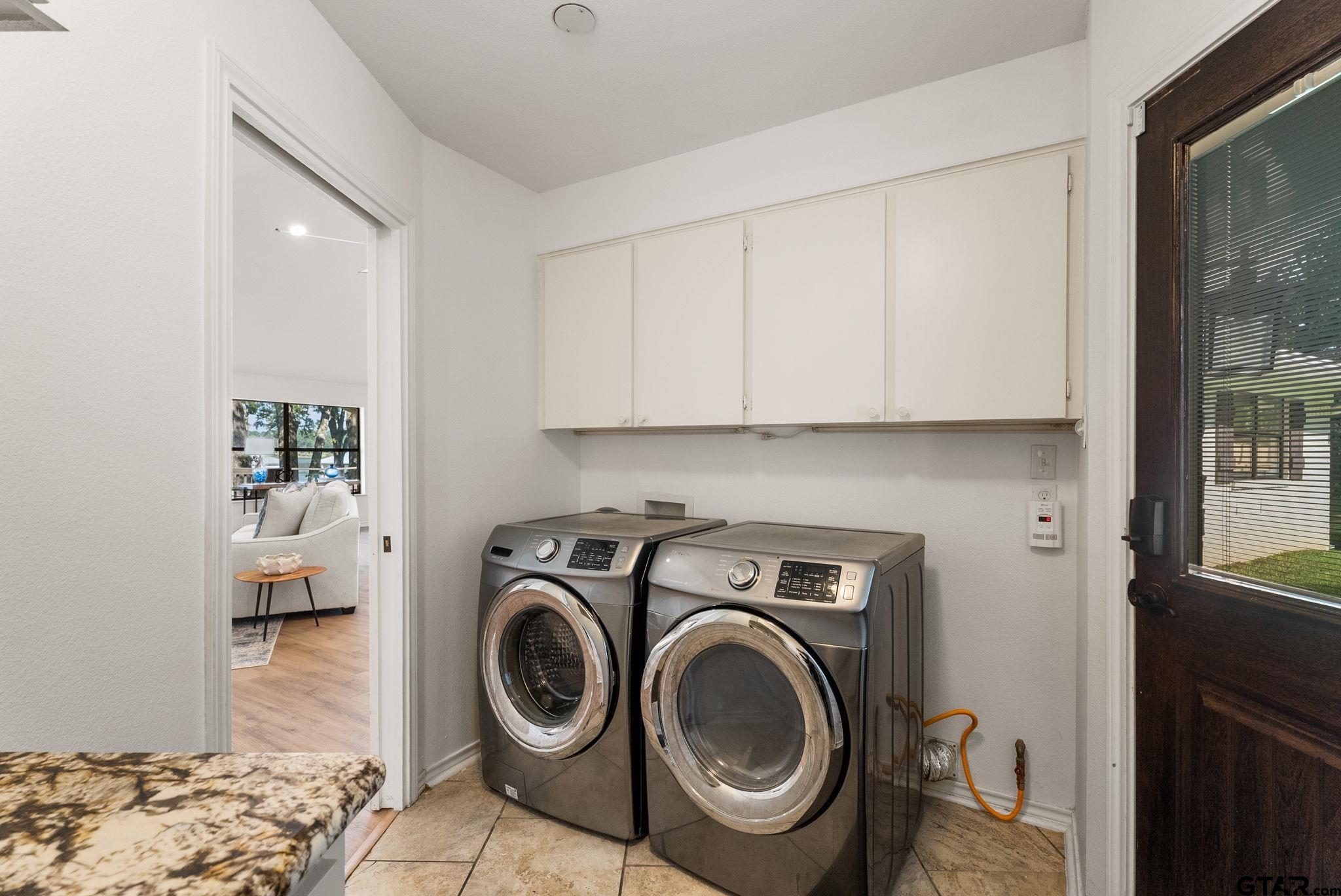 13235 Peninsula Road Whitehouse, TX 75791 - Photo 30 of 48 a utility room with sink dryer and washer