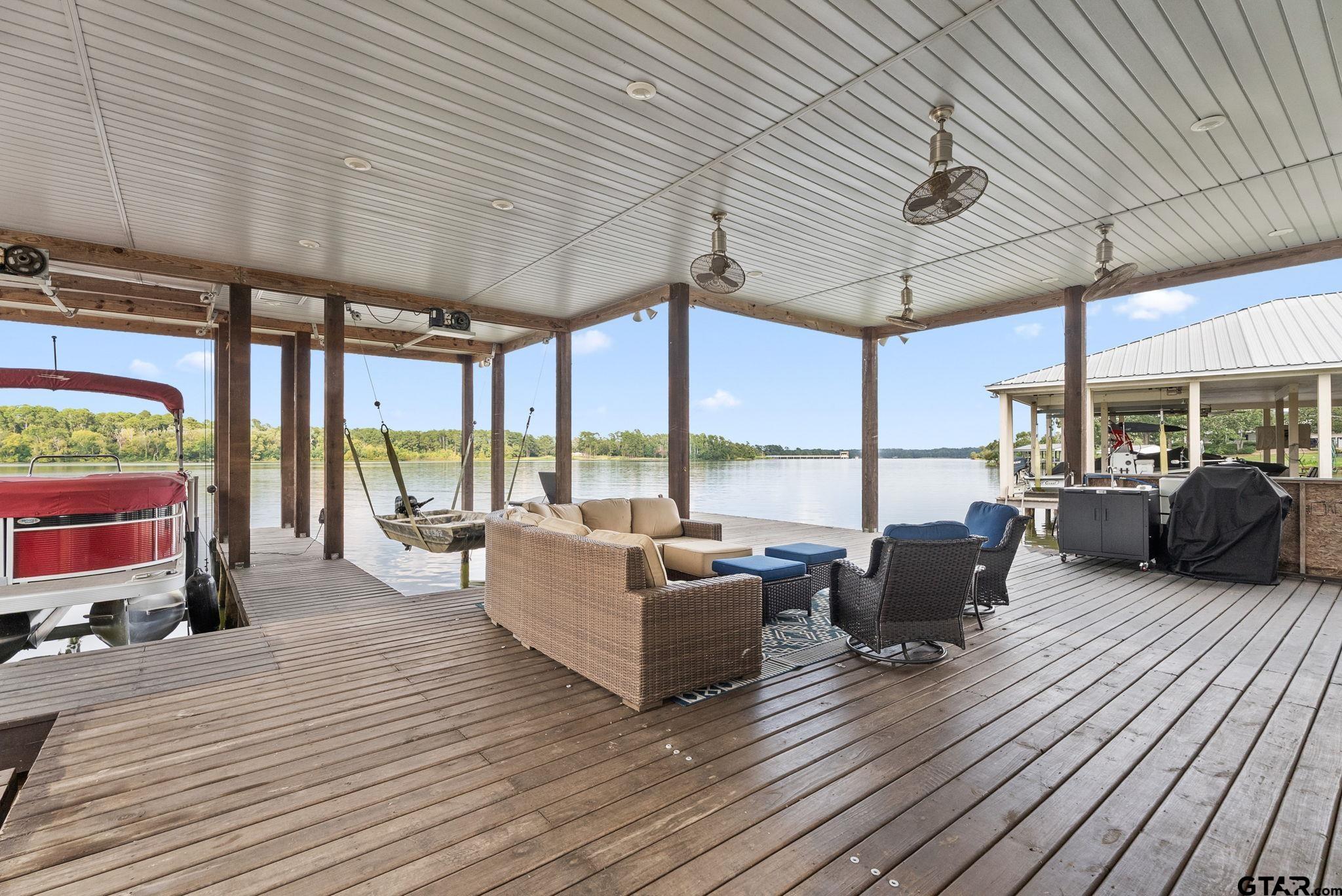 13235 Peninsula Road Whitehouse, TX 75791 - Photo 39 of 48 a living room with lots of furniture wooden floor and outdoor seating