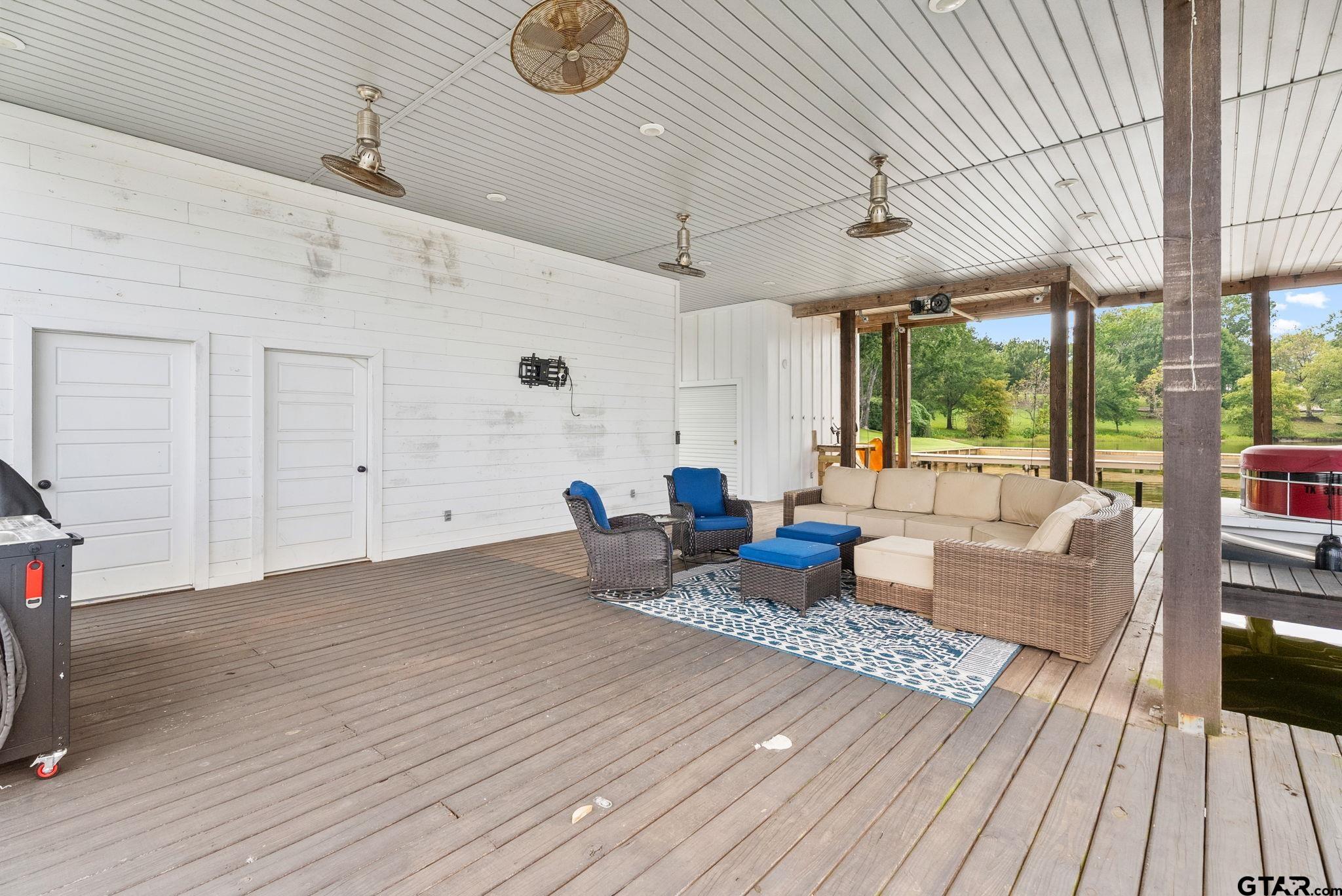 13235 Peninsula Road Whitehouse, TX 75791 - Photo 41 of 48 a living room with furniture and a wooden floor