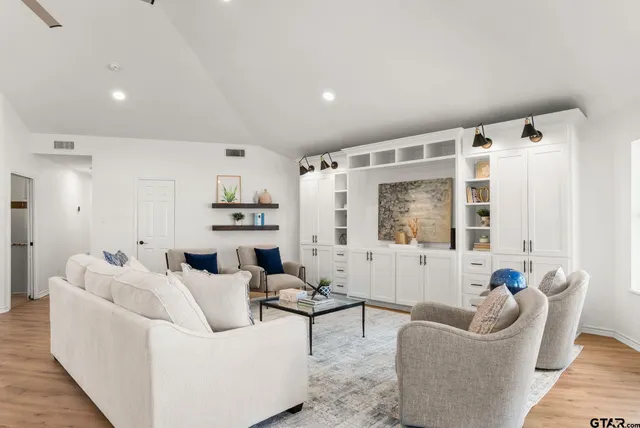 a living room with furniture and a large window