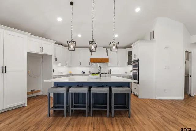 a kitchen with a table and chairs in it