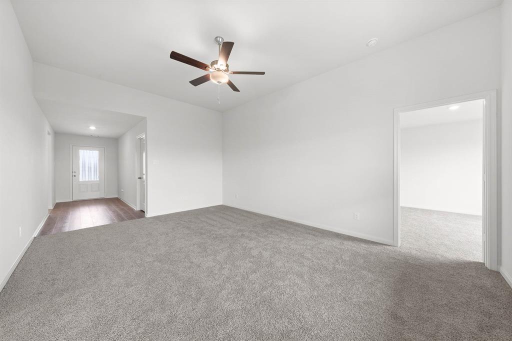 1341 Wind Drift Way Fort Worth, TX 76131 - Photo 5 of 8 a view of a livingroom with a ceiling fan and window