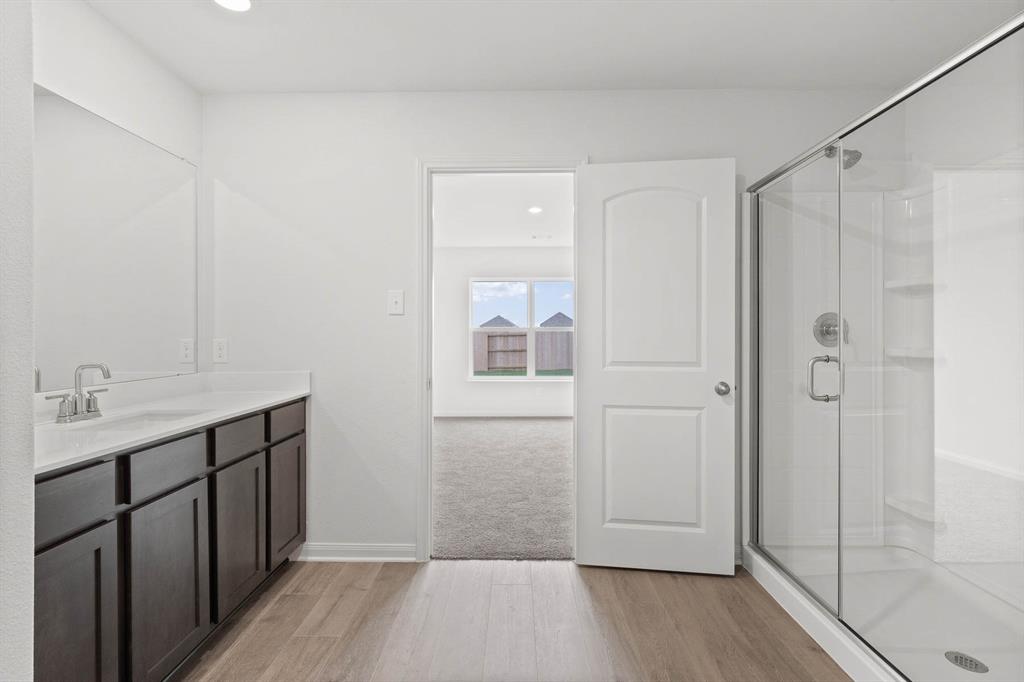 1341 Wind Drift Way Fort Worth, TX 76131 - Photo 6 of 8 a bathroom with a shower and a sink