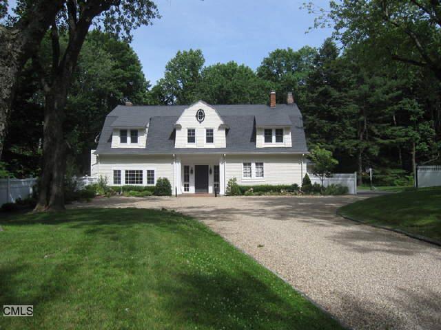 269 West Lane Ridgefield, CT 06877 - Photo 1 of 1 a front view of a house with a garden