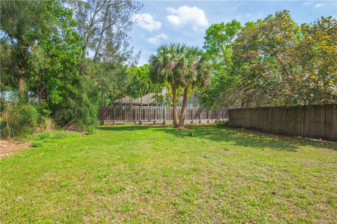 1406-1408 36th Avenue Vero Beach, FL 32960 - Photo 16 of 16 a view of a backyard with a garden