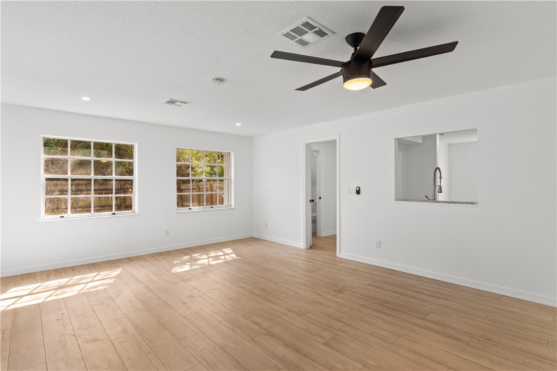 1406-1408 36th Avenue Vero Beach, FL 32960 - Photo 5 of 16 a view of empty room with wooden floor and ceiling fan