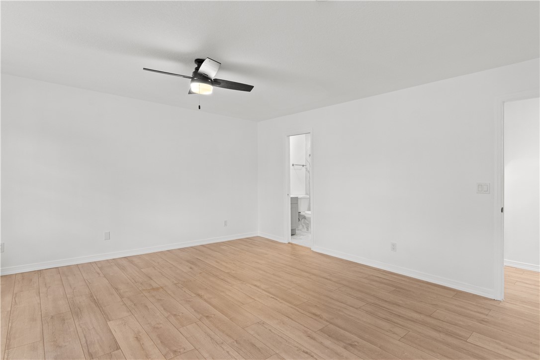 1406-1408 36th Avenue Vero Beach, FL 32960 - Photo 8 of 16 a view of empty room with wooden floor