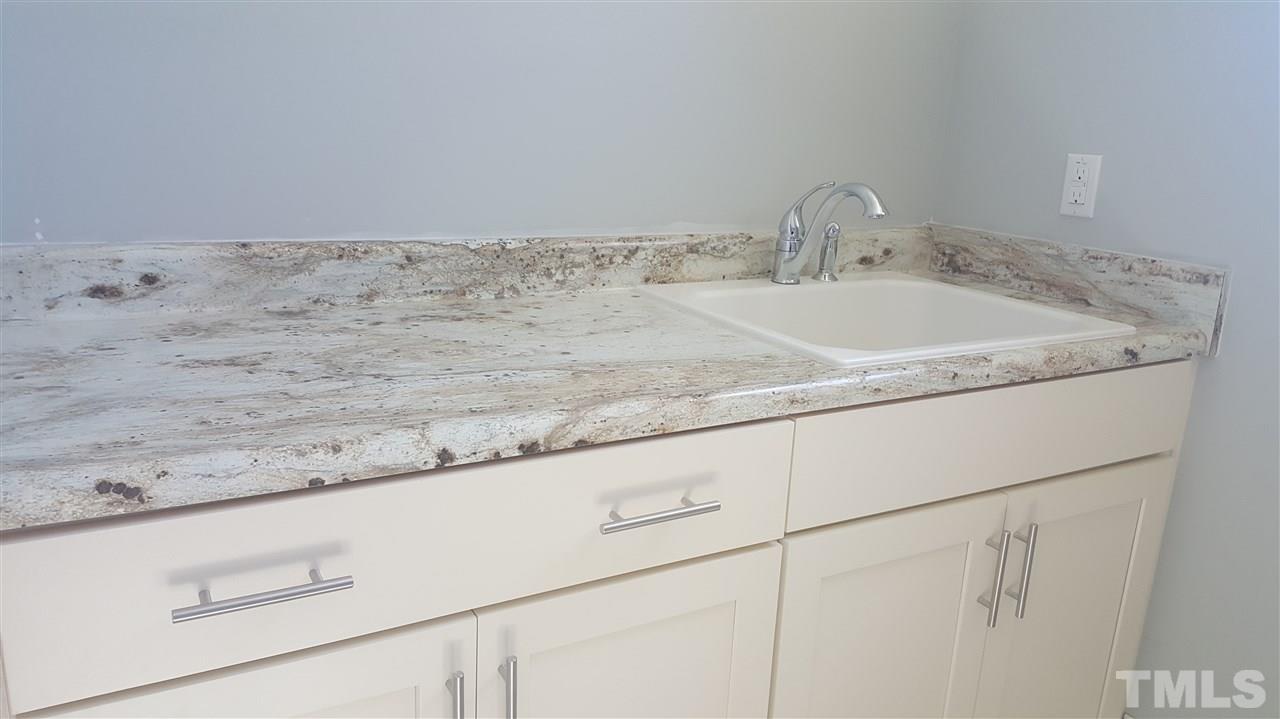 7748 Wilderness Road Raleigh, NC 27613 - Photo 15 of 25 Utility sink in laundry