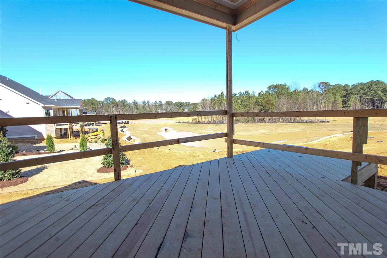 7748 Wilderness Road Raleigh, NC 27613 - Photo 22 of 25 Beautiful view of the pond, see rendering for future pond representation