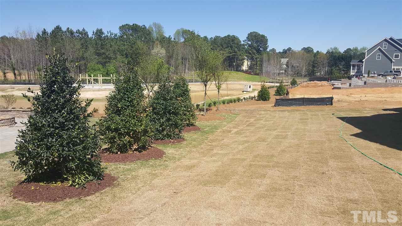 7748 Wilderness Road Raleigh, NC 27613 - Photo 23 of 25 Beautiful open lot that backs up to pond and walking trails