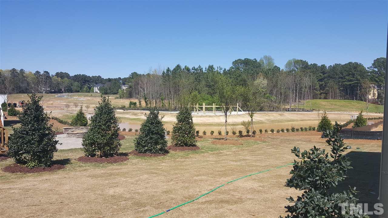 7748 Wilderness Road Raleigh, NC 27613 - Photo 24 of 25 View of pond from screened in deck