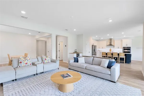 a living room with furniture and a table