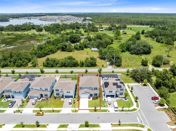 an aerial view of residential houses with outdoor space