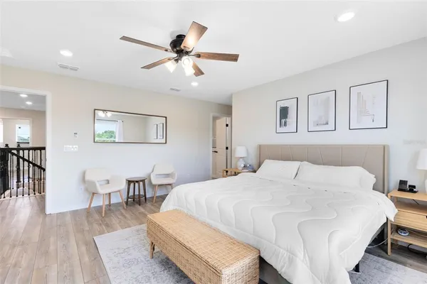 a bedroom with a bed and a table