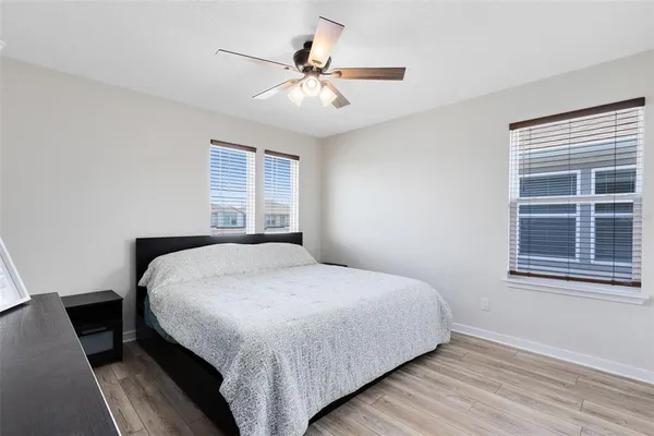 a bedroom with a bed and window