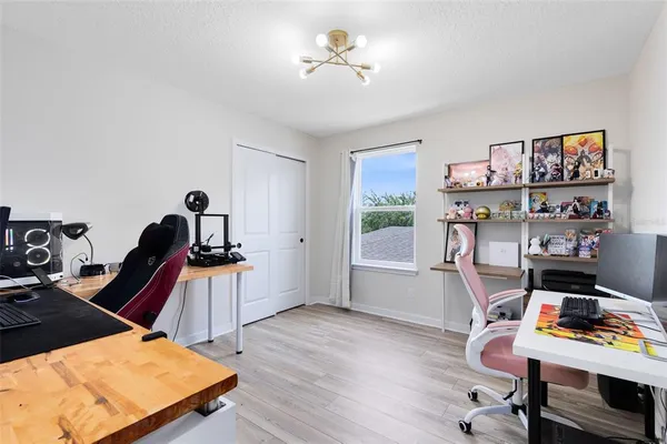 a workspace with furniture and a window