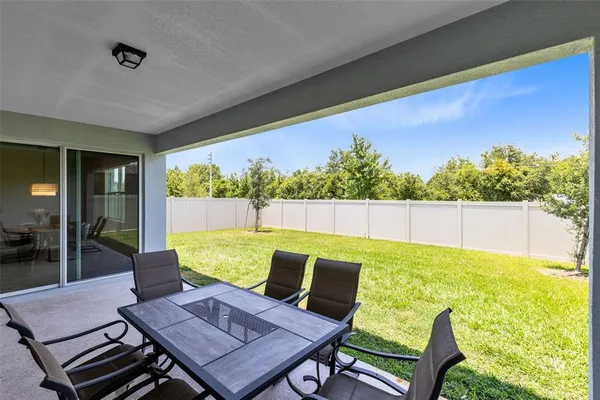 a view of an outdoor dining space with furniture