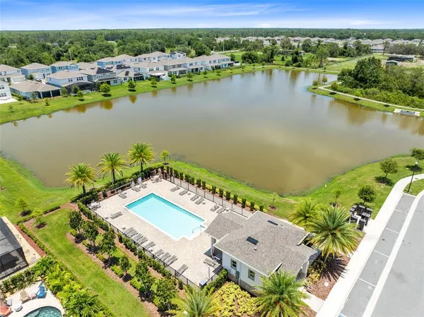 an aerial view of a city with lake view