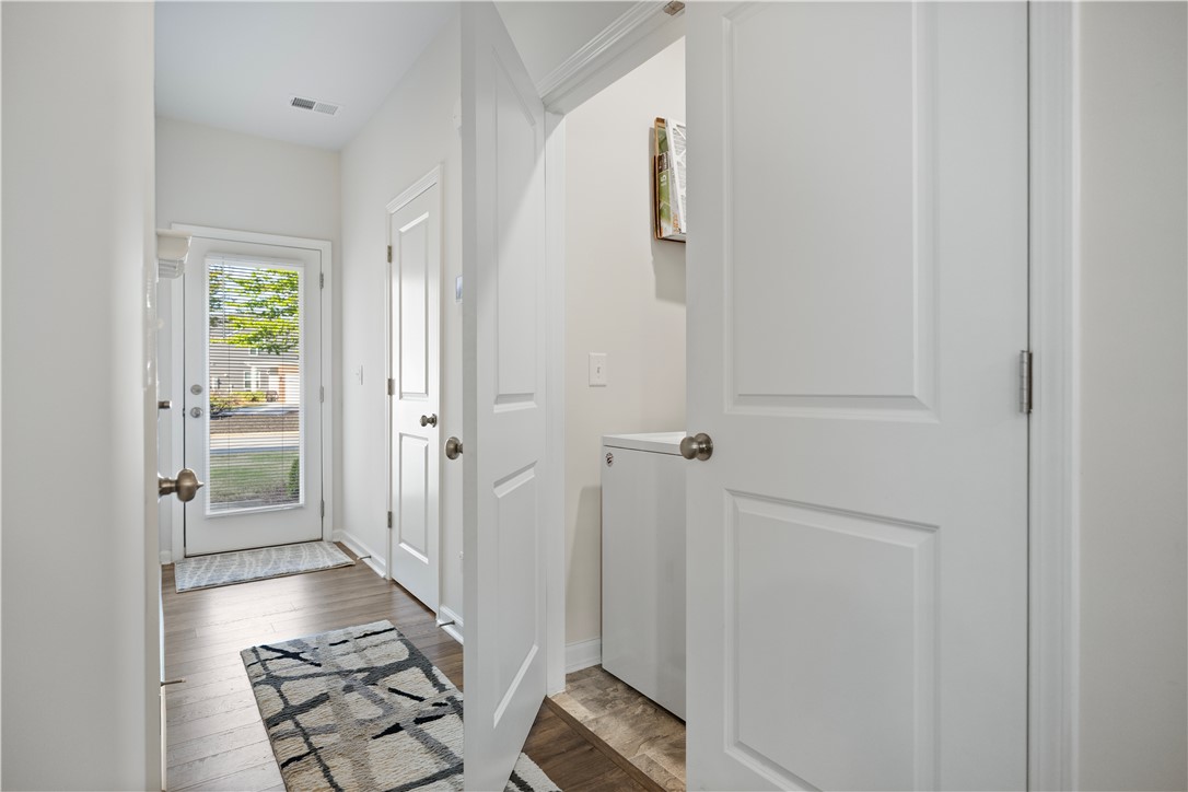 104 Village Main Anderson, SC 29621 - Photo 13 of 32 This bright hallway connects to a convenient laundry area and welcomes with ample natural light.
