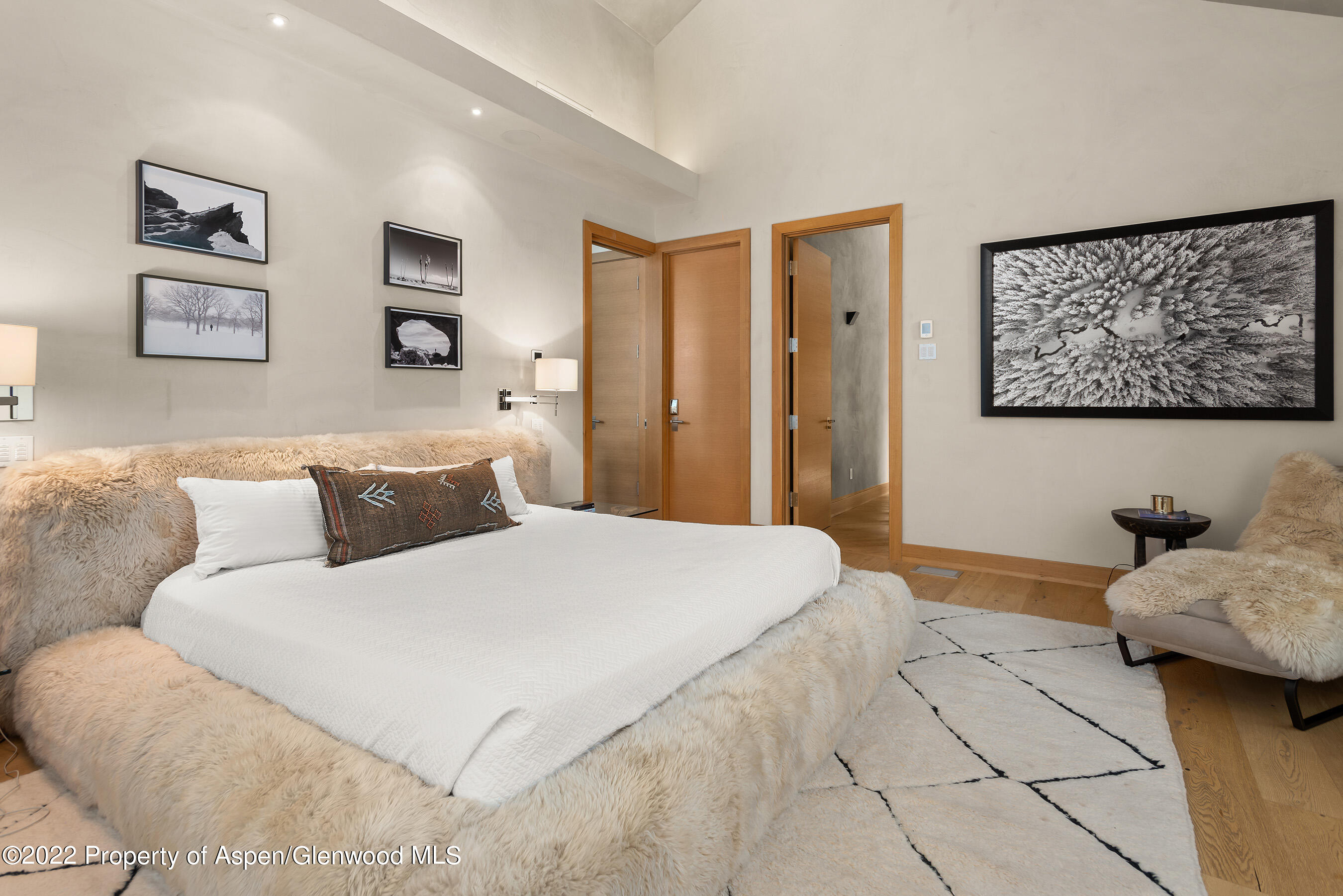 136 Northway Drive Aspen, CO 81611 - Photo 13 of 31 a bedroom with a large bed and a couch