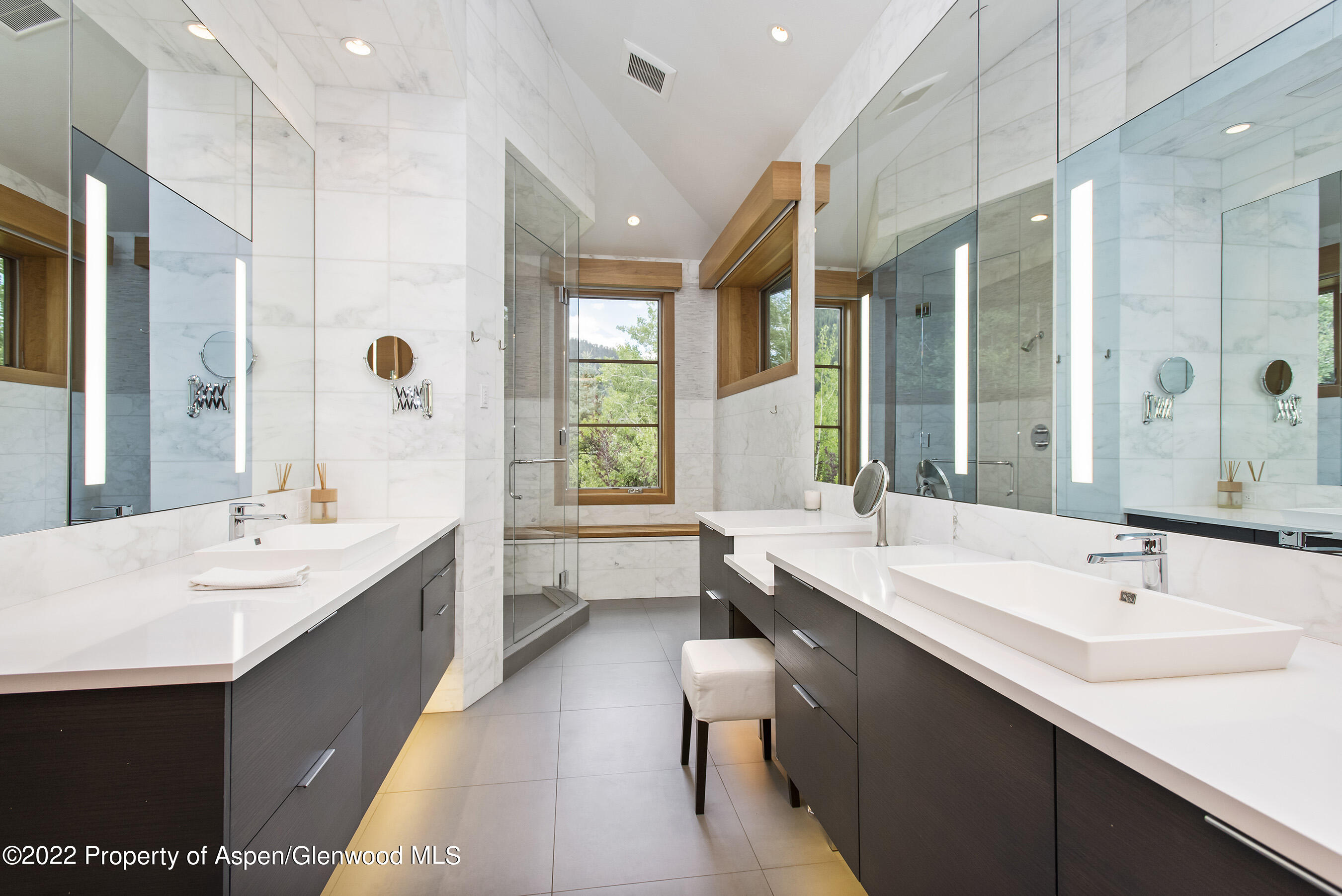136 Northway Drive Aspen, CO 81611 - Photo 14 of 31 a large bathroom with a double vanity sink large mirror and a bathtub
