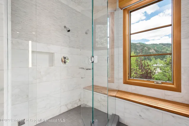 a bathroom with a bathtub and shower