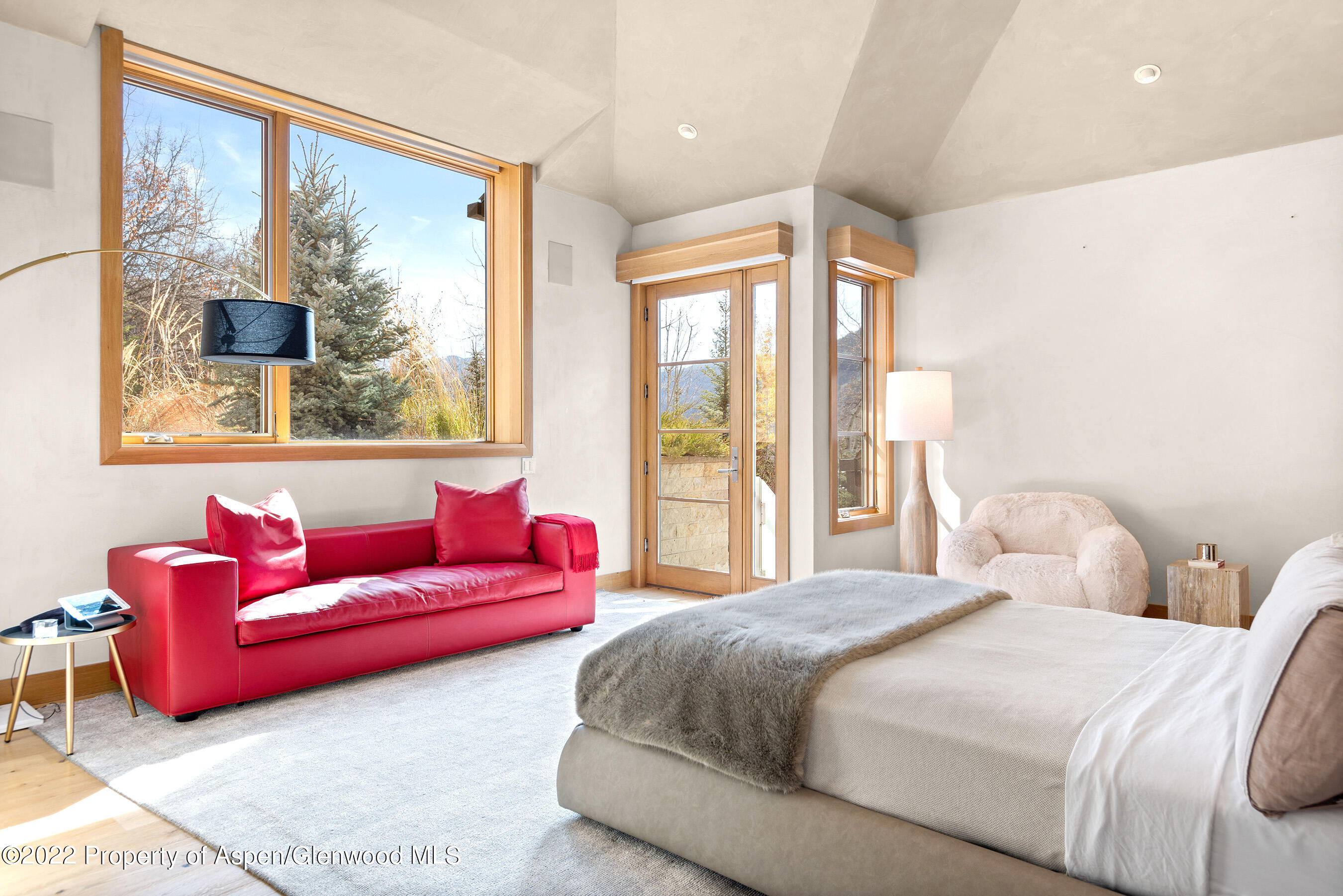 136 Northway Drive Aspen, CO 81611 - Photo 18 of 31 a bedroom with a bed and large windows