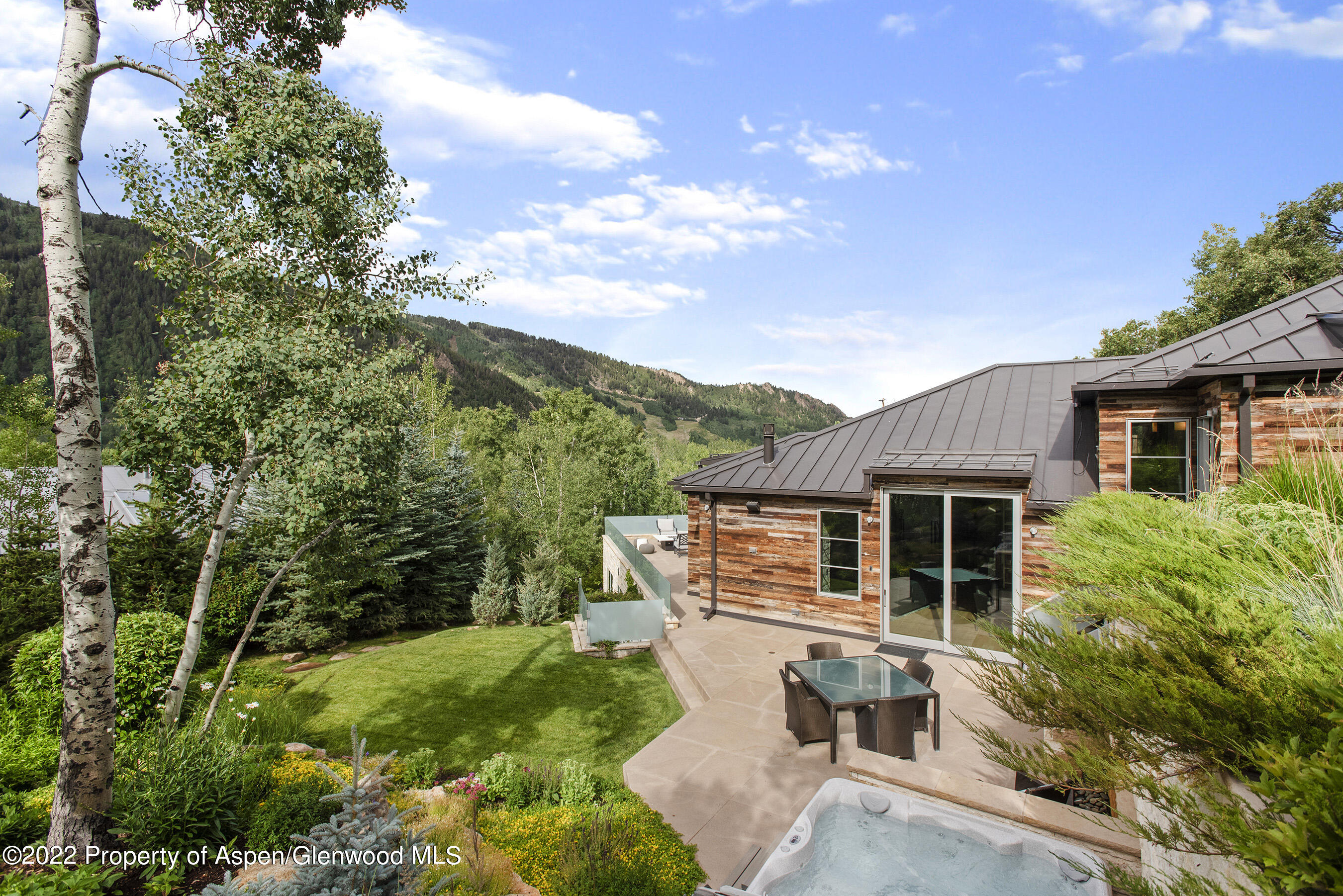 136 Northway Drive Aspen, CO 81611 - Photo 29 of 31 a house with trees in the background