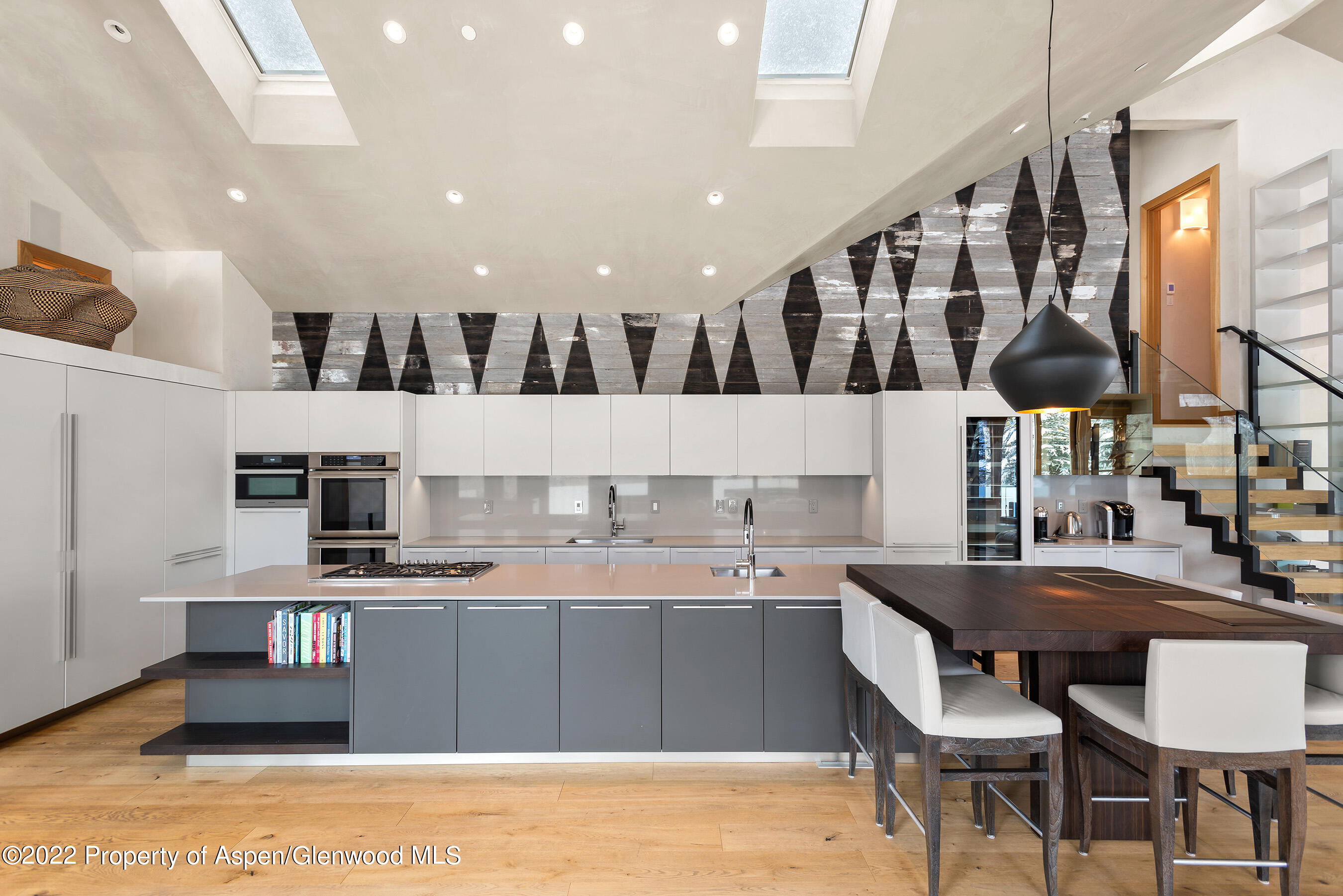 136 Northway Drive Aspen, CO 81611 - Photo 5 of 31 a kitchen with stainless steel appliances kitchen island granite countertop a sink and cabinets