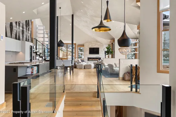 a gym hall with stainless steel appliances kitchen island granite countertop a stove and a sink with granite countertops