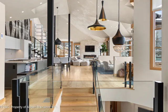 a gym hall with stainless steel appliances kitchen island granite countertop a stove and a sink with granite countertops