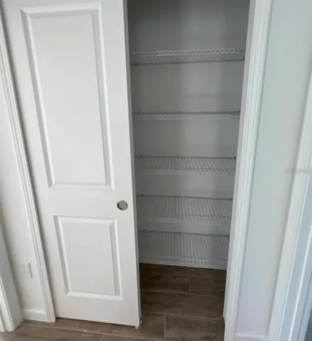 an empty room with wooden door