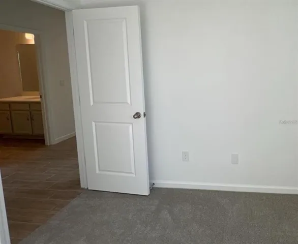 an empty room with closet area