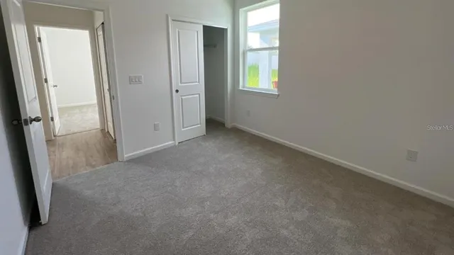 a bathroom with a double vanity sink a mirror and shower