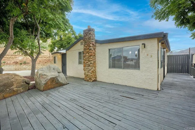 a front view of a house with yard