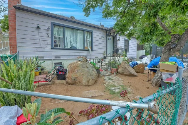 a view of a chairs and table in the patio