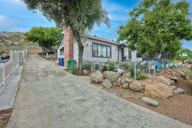 a front view of a house with a yard and a garage