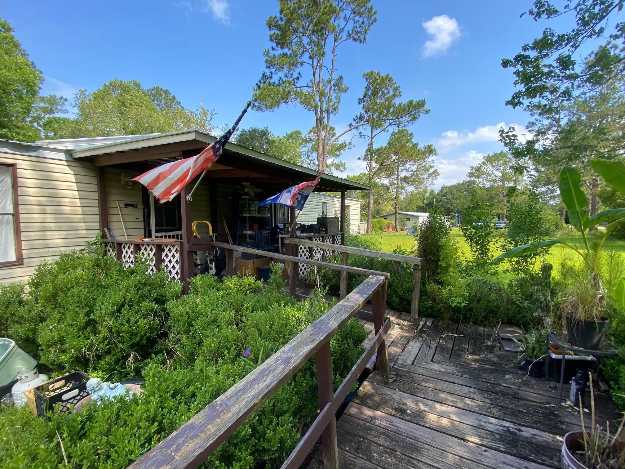 2829 Green Acres Rd Extension St. Augustine, FL 32084 - Photo 4 of 10 a view of a chairs and table in the balcony