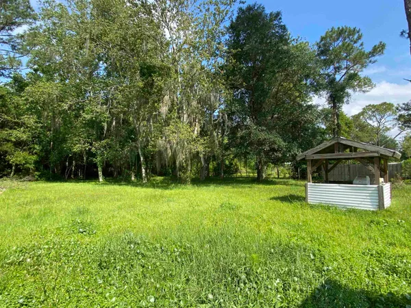 a view of a backyard with a garden