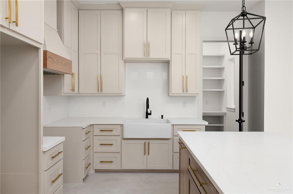 200 Micaela Road, Unit SERVICE Penitas, TX 78576 - Photo 13 of 30 a kitchen with cabinets appliances and a sink