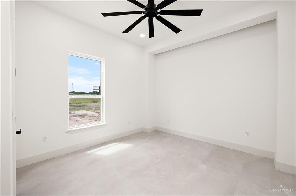200 Micaela Road, Unit SERVICE Penitas, TX 78576 - Photo 17 of 30 an empty room with a window and a fan