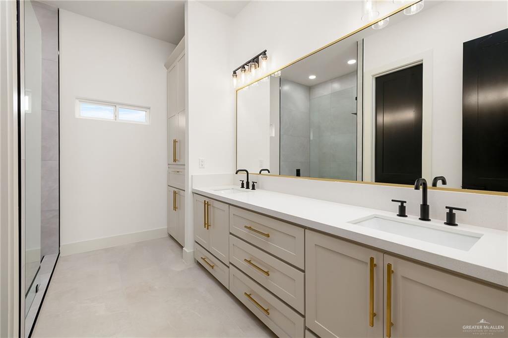 200 Micaela Road, Unit SERVICE Penitas, TX 78576 - Photo 18 of 30 a bathroom with double sink and a mirror