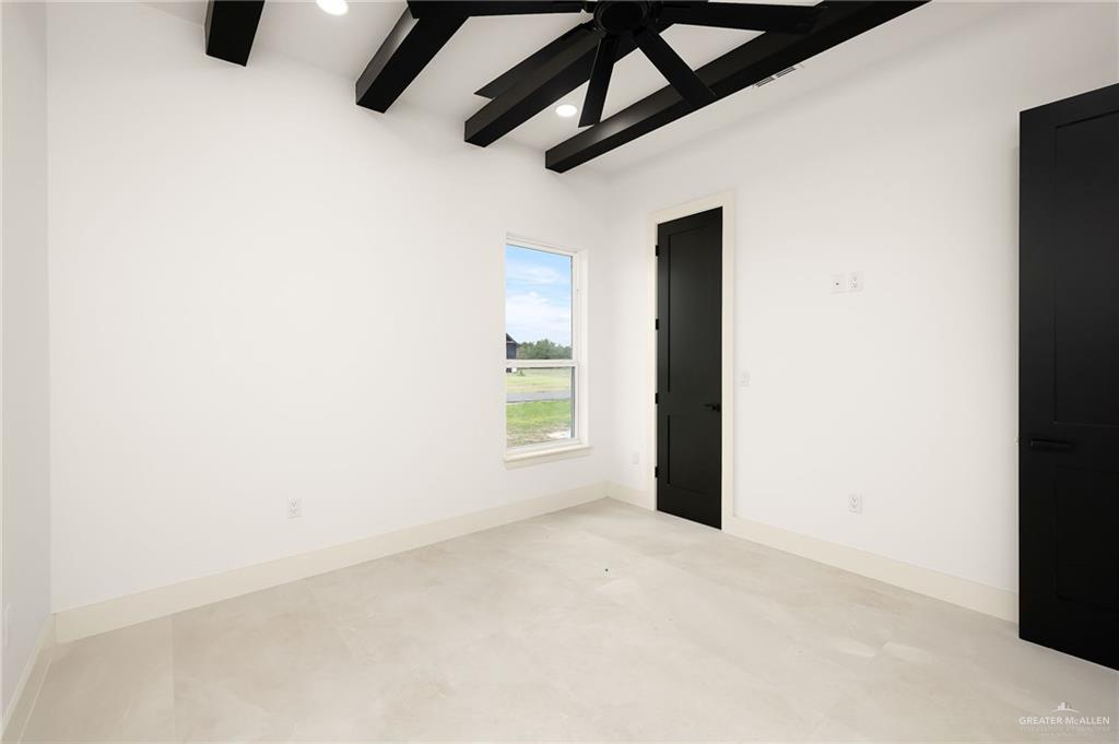 200 Micaela Road, Unit SERVICE Penitas, TX 78576 - Photo 19 of 30 an empty room with a windows and ceiling fan