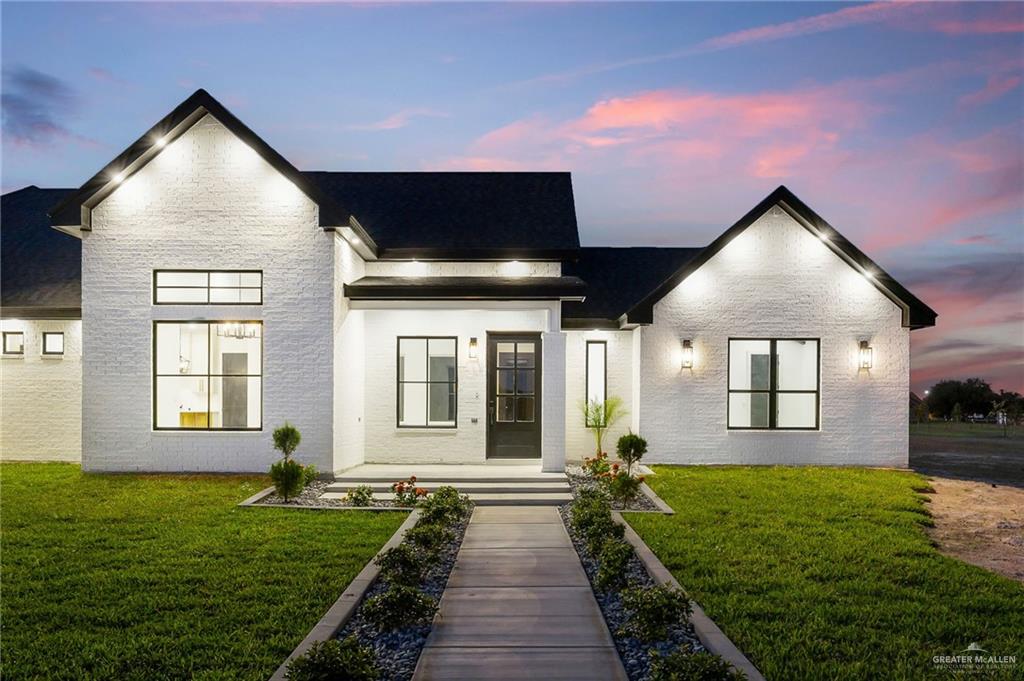 200 Micaela Road, Unit SERVICE Penitas, TX 78576 - Photo 2 of 30 a front view of a house with garden
